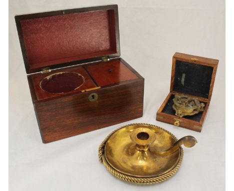A 19th century rosewood tea caddy, together with a reproduction brass compass and brass chamber stick.