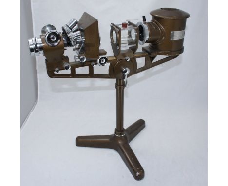 A 'Micro-Projector' instrument by Flatters & Garnett Ltd. Manchester, raised on adjustable support to a tripod base. 46cm wid