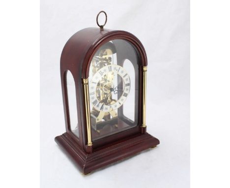 A 20th century stained dome-top mantle clock by Hermle, the silvered dial with Roman numerals denoting hours and exposed move