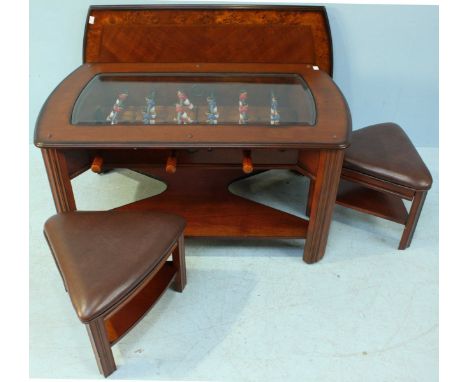 A modern 3-in-1 coffee table, the top lifting off to reveal a foosball table, the reverse of the lid showing a green, playing