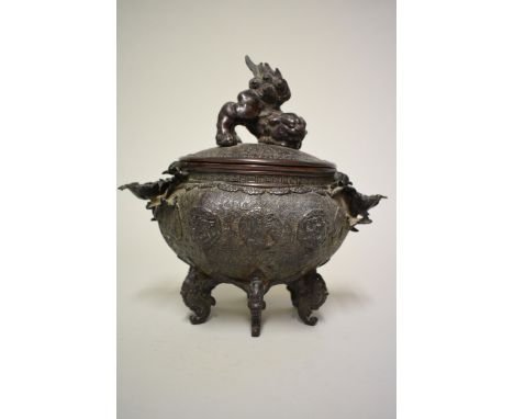 An unusual Chinese bronze twin handled hexagonal censer and cover,&nbsp;with lion dog finial, flower head handles and fish fo