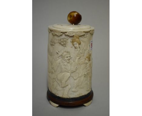 A Japanese ivory tusk vase and cover, Meiji, carved in relief with a figure and geishas in a garden, total height 21.5cm, (fi