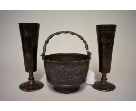A Chinese bronze swing handled censer, relief decorated with dragons, 15cm diameter; together with a pair of Indian niello pe