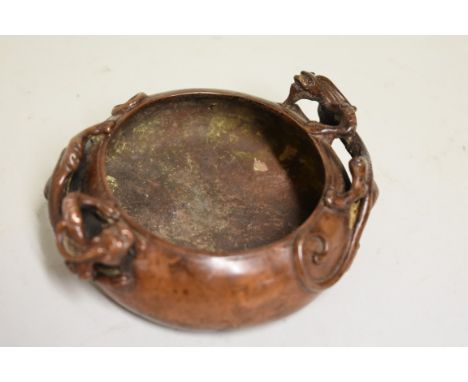 A Chinese bronze twin handled censer,&nbsp;four character seal mark to base, with chilong handles, 12cm wide, 359g. 