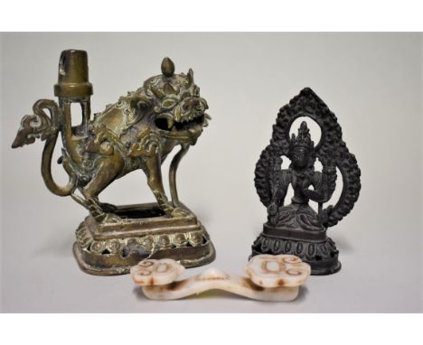 A small group of items, comprising: a small jadeite ruyi, 11cm long; a bronze bodhisattva, 12.5cm high; and a bronze qilin, 1