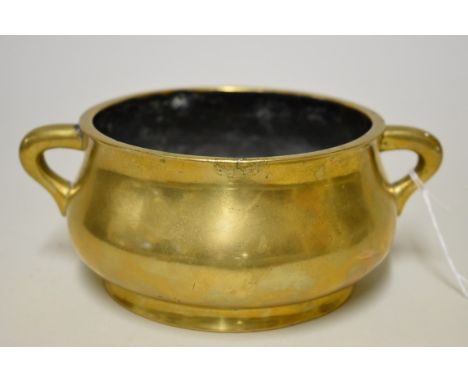 A Chinese bronze twin handled censer, Xuande six character mark, 19cm wide, 1101g. 