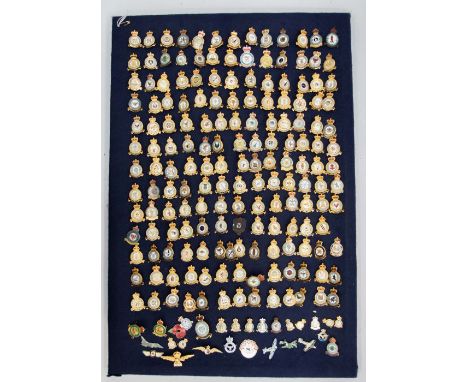A pin board containing 96 gilt metal and enamel RAF Squadron and other associated badges, varying ages, some with Kings Crown