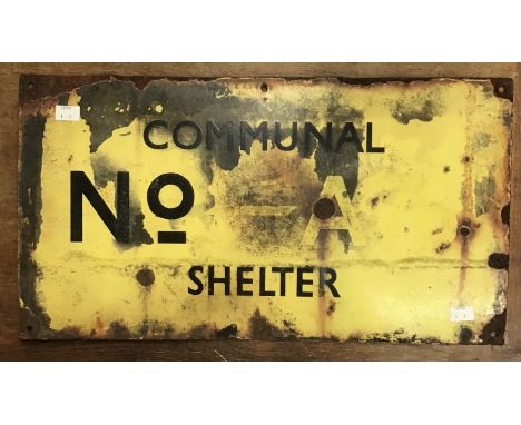A WWII Communal air raid shelter enamel sign, yellow with black lettering, communal number A76 shelter, 53.5cm x 29cm (family