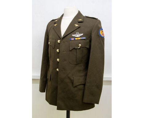 A Dutch Army tunic, dated 1983 on internal label, now fitted with US Army Insignia and medal ribbons (good condition)These Du