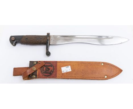 A WWII era Spanish M1941 Bolo bayonet by the Toledo Arms Factory with checkered wooden grip and macneta style steel blade, th