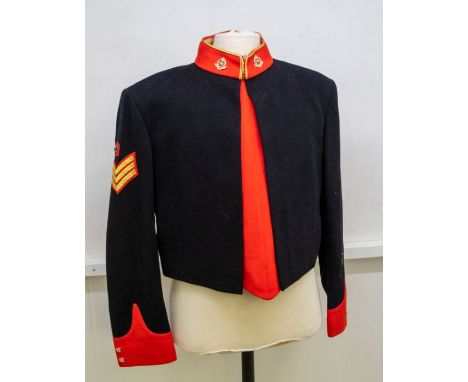British Army Sergeants mess tunic, black wool with red facings and gold edging to the collar, fitted with Warrant Officer str