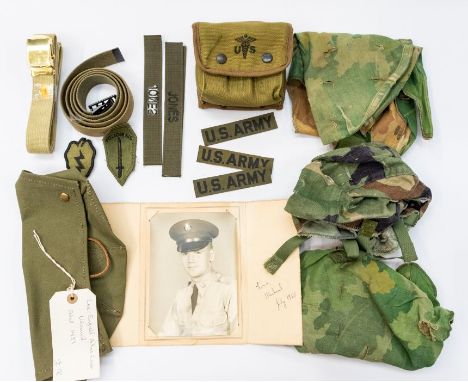 A collection of canvas and webbing equipment including a Lee Enfield Rifle cover, faintly marked inside for 1951 (seemingly u