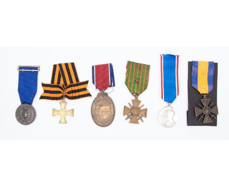 A selection of foreign decorations and medals.To include: a South African John Chard medal, an Italian Al Valore medal, a Rus