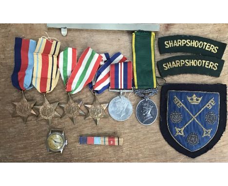 WWII group of medals and badges to 7886456 Cpl B.P. Barker 3rd County of London Yeomanry (A.K.A Sharpshooters) of 1939-45 sta