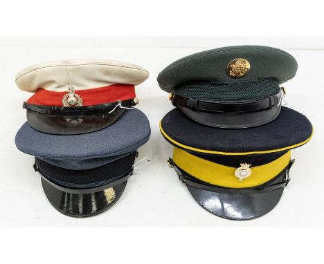 A collection of four militaria caps including; a Royal Marines cap, fitted with QEII Crown badge (stained crown and ripped li