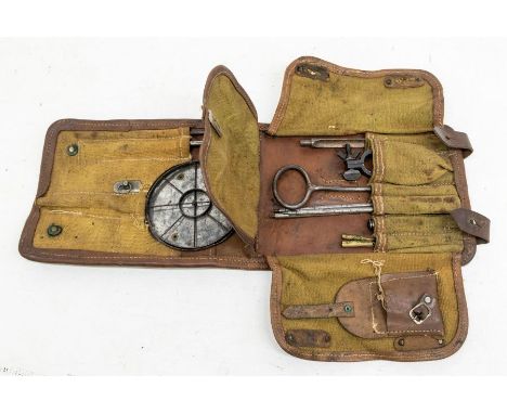 A potentially rare WWII ear Spider Web type gun sight with associated tools housed in a canvas and leather pouch, the leather