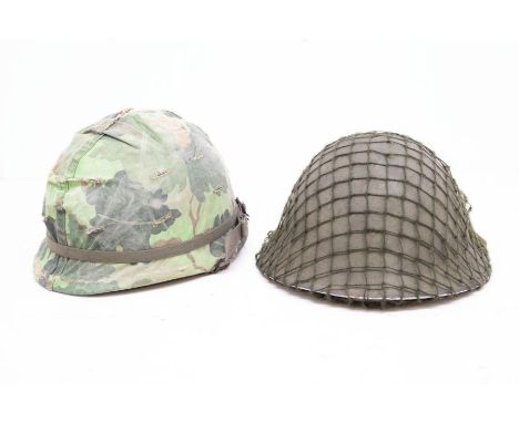 A British P-1944 pattern Turtle helmet, 1970's dates to the liner, complete with chin strap and net cover, plus US Vietnam Wa