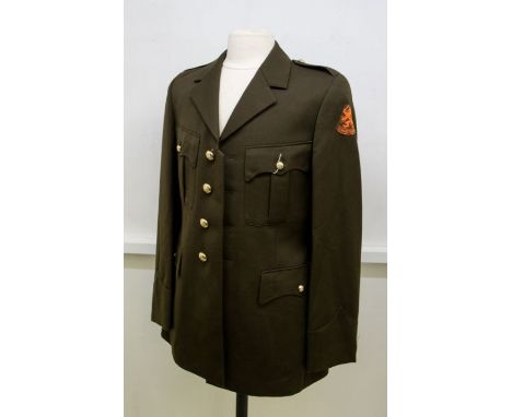 Dutch Army tunic fitted with a cloth Je Maintiendrai arm patch and gilt Dutch Lion buttons, internal label dates the item to 
