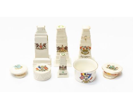A collection of WWI era crested china pieces, to include: 4 cenotaph models (3 large, 1 small); 2 Army Office caps; plus a 19