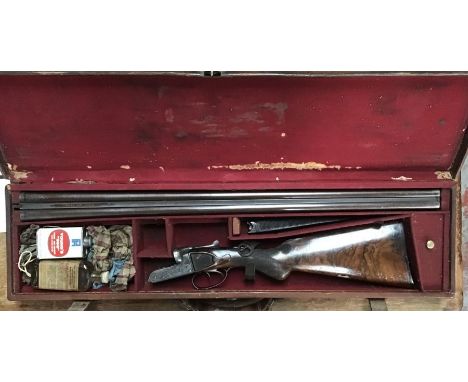 C.H. Smith 12 bore side by side with Damascus steel barrel well etched and carved in Original leather case, cleaning rods & p