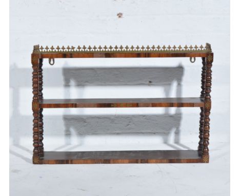 William IV rosewood wall shelf, later applied gallery, brass inlay, the open shelves with turned and ringed uprights, width 8