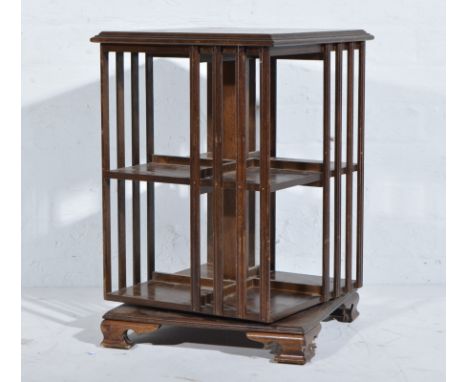 Edwardian oak revolving bookcase, of square section, moulded edge, plain vertical rails, ogee bracket feet, width 40cm, heigh