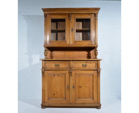 French pine dresser, moulded cornice, plain frieze, the upper section with two glazed doors enclosing a shelf, turned support