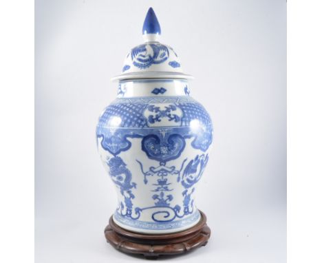 Large Chinese blue and white vase and cover on a hardwood stand, together with a lamp base and another vase and cover, (3)