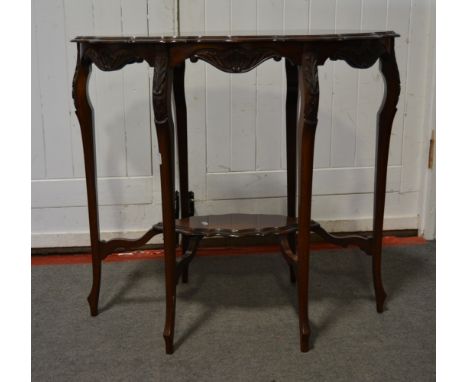 Edwardian window table, shaped oval top, carved cabriole legs joined by a shelf,  the top 79 x 52cm, height 72cm.