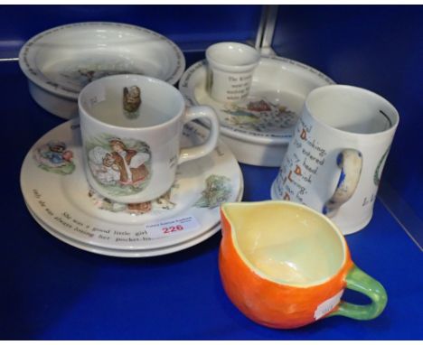 A CARLTON WARE 'HANGMAN'S MUG, and an Orange shaped jug with a collection of Wedgwood Beatrix Potter nursery wares