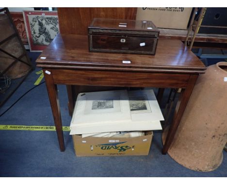 A GEORGE III MAHOGANY CARD TABLE, on tapered scratch-moulded legs, 83cm wide