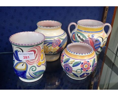 A COLLECTION OF POOLE POTTERY VASES with traditional decoration (4)