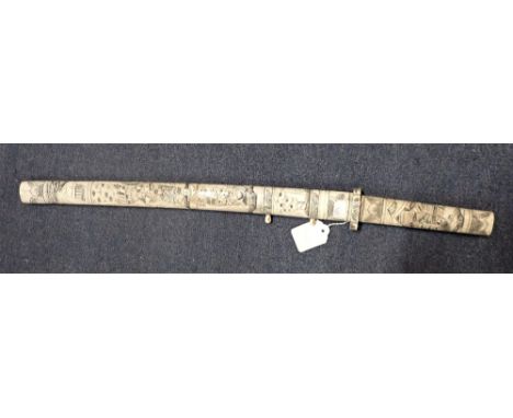 AN ORIENTAL SHORT SWORD, THE IVORY SCABBARD and a grip carved all over with fugures, 59 cm long