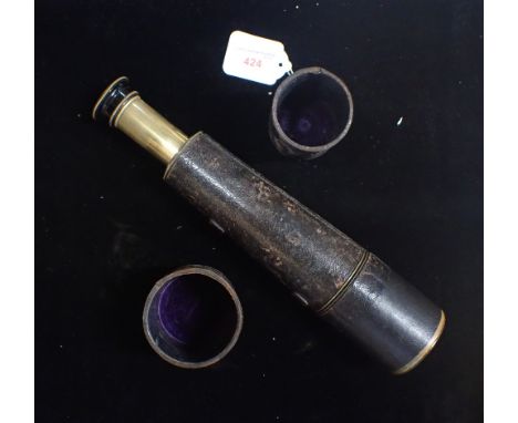 A BRASS TELESCOPE, WITH LEATHER COVER AND CAPS; 'WRAY, LONDON, 'THE STALKER' No. 5320'