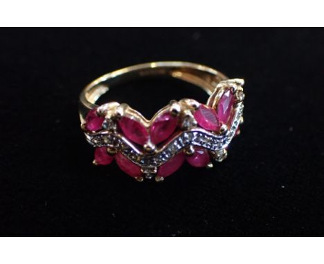 A 'RUBY' AND PASTE DRESS RING, on a 9ct yellow gold shank, ring size Q (3.54 grams)