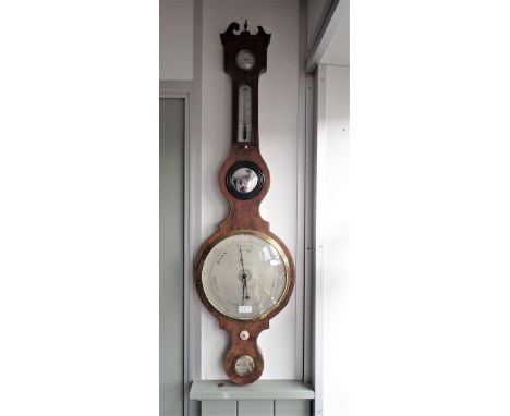 A GEORGE III MAHOGANY WHEEL BAROMETER, the dial inscribed, 'F. AMADIO &amp; SON LONDON' 110cm high
