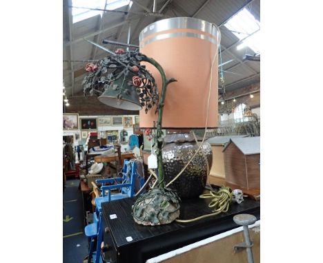 A VINTAGE PAINTED METAL TABLE LAMP, in the form of rambling roses above a rocky ivy base, 56cm high and a glazed silvered tab