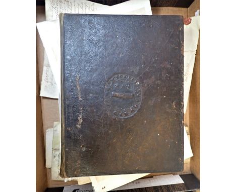 A 17TH CENTURY LEATHER BINDING (ONLY) EMBOSSED WITH AN ARMORIAL, AND THE DATE '1603', with a collection of paper and parchmen
