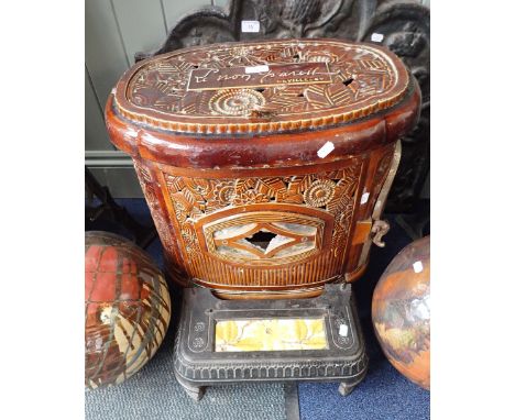 A VINTAGE FRENCH CAST IRON AND BROWN ENAMEL MULTI-FUEL STOVE, Deville &amp; Cie., 55cm high x 54cm wide x 35cm deep with a si