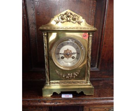 A LATE 19TH CENTURY BRASS CASED MANTEL CLOCK, OF ARCHITECTURAL FORM, with cast foliate decoration and flanking columns, the P