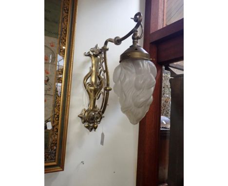 AN EARLY 20TH CENTURY BRASS AND NICKEL PLATED ART NOUVEAU WALL LIGHT, with later flambeau shade
