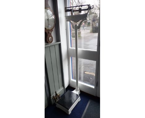 A SET OF VINTAGE CAST IRON MEDICAL WEIGHING SCALES, 160cm high