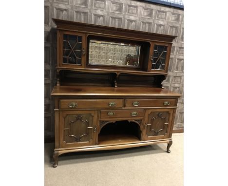 EDWARDIAN MAHOGANY MIRROR BACK SIDEBOARDthe raised back with central bevelled mirror and open shelf, flanked by glazed cupboa