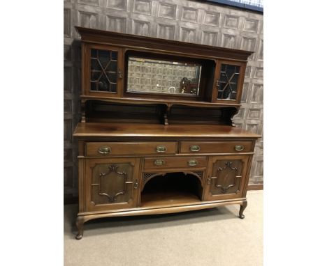 EDWARDIAN MAHOGANY MIRROR BACK SIDEBOARDthe raised back with central bevelled mirror and open shelf, flanked by glazed cupboa