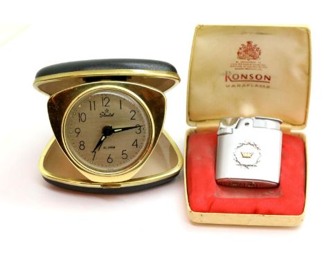 Boxed Ronson Varaflame lighter and vintage travel alarm clock. P&amp;P Group 1 (£14+VAT for the first lot and £1+VAT for subs