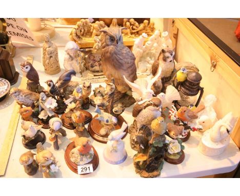 Ceramic and other bird figurines including a Beswick Osprey decanter. Not available for in-house P&amp;P 