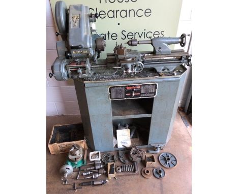 A MYFORD SUPER 7 METALWORKING LATHE ON CABINET with a collection of accessories, chucks, tools etc. Powers up and runs (other