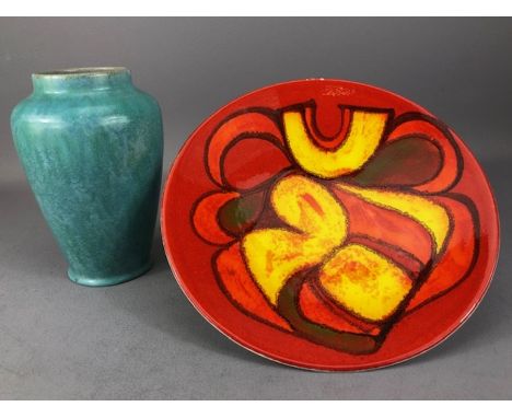 Two items of Poole pottery: a Sylvan Ware green vase with impressed and painted marks approx 19cm in height, and a Delphis pl