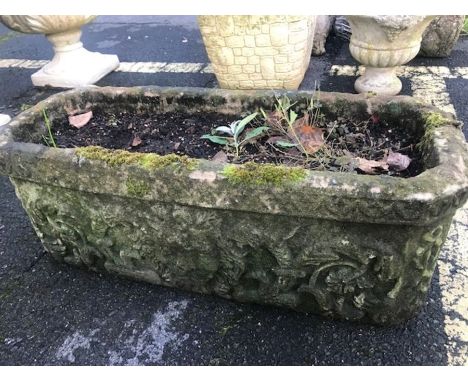 Stone garden trough / planter with lions head deign, approx 71cm x 27cm x 28cm tall