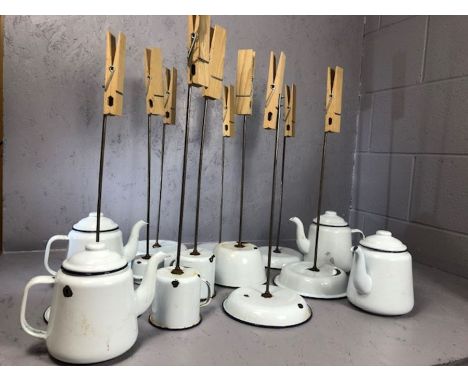 Collection of vintage enamel ware re-purposed as menu / card holders with giant wooden pegs